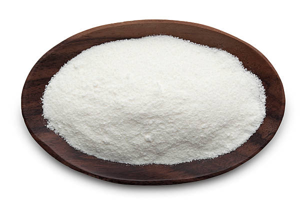 close of dark wood bowl with white powder