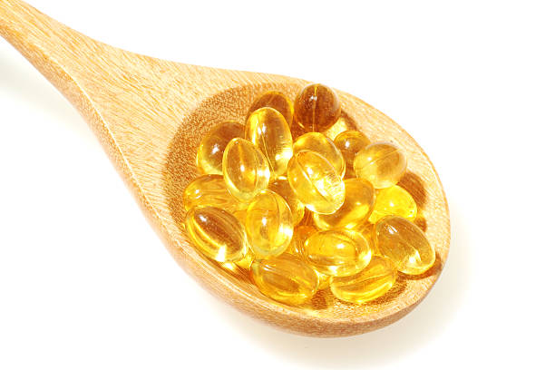 wooden spoon with B12 gel supplements